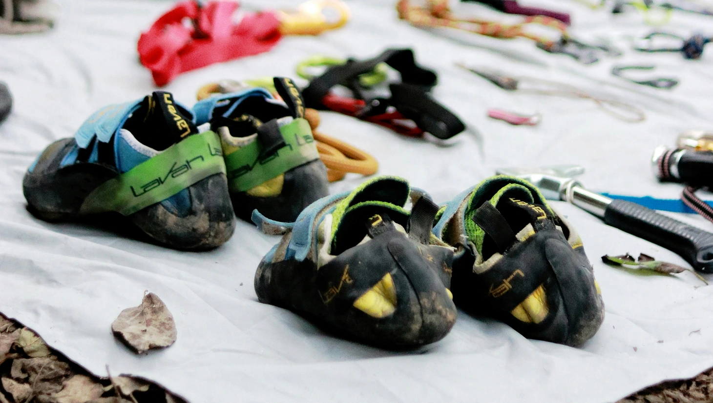 Climber putting on a climbing shoe